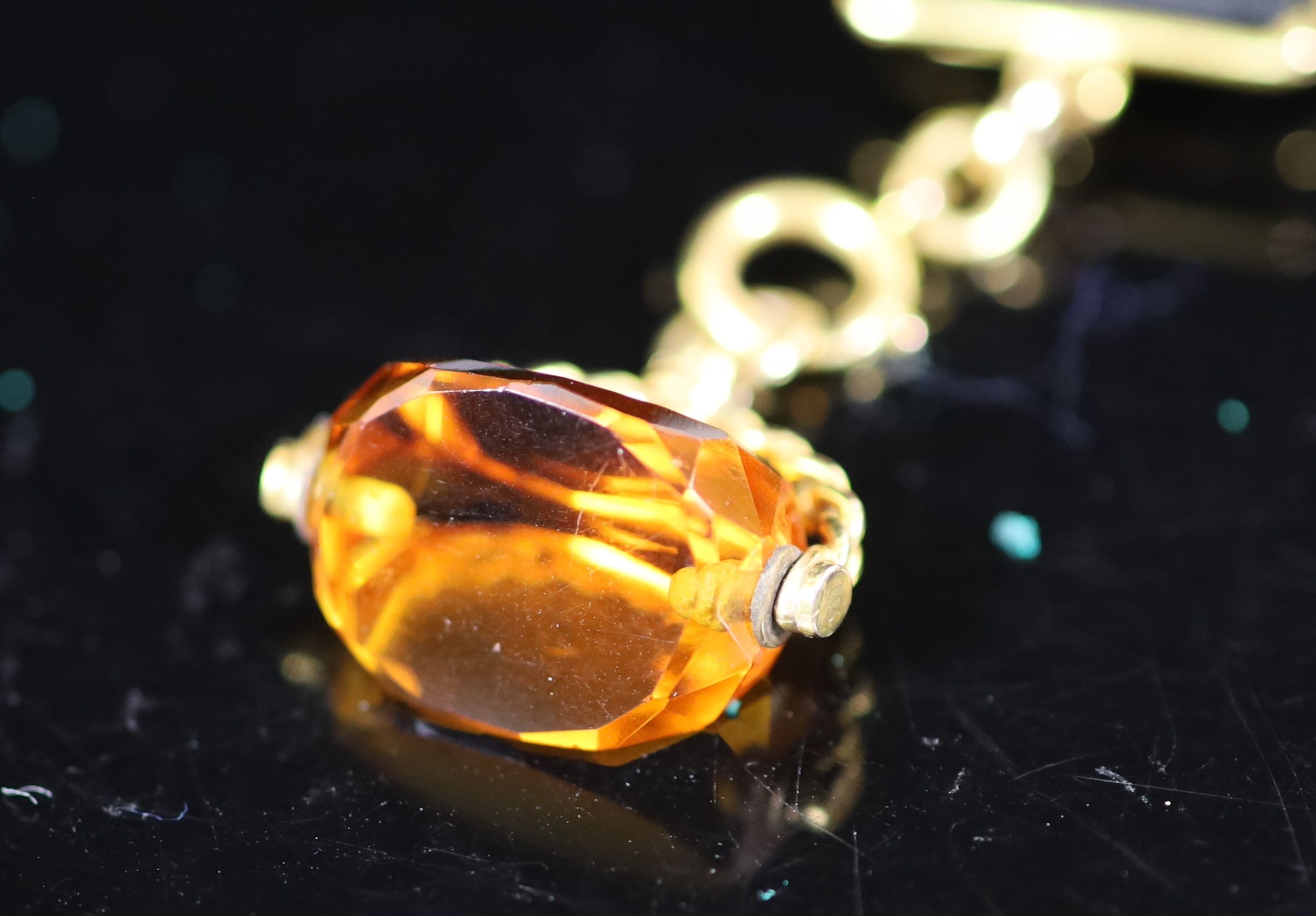 An 18ct gold full hunter keyless lever pocket watch, having white enamel Roman dial with subsidiary seconds dial, engraved monogram, on a 9ct mounted black silk ribbon, with 9ct and amber swivelling fob